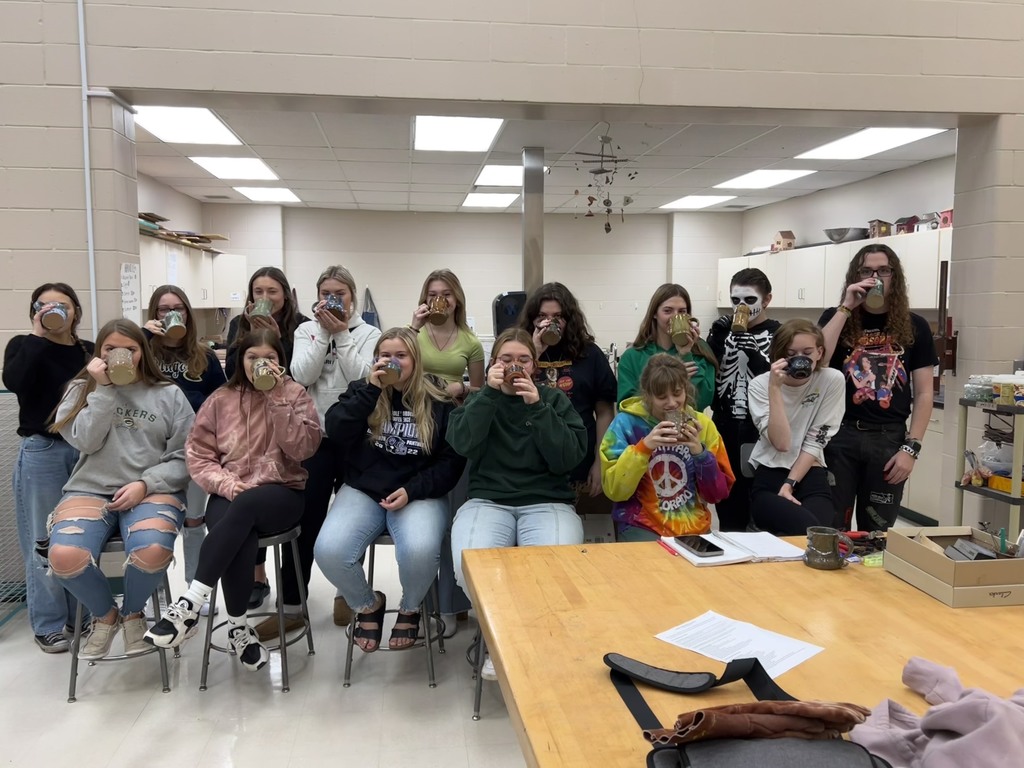 Q1 ceramics class drinking hot coco out of their handmade mugs. 